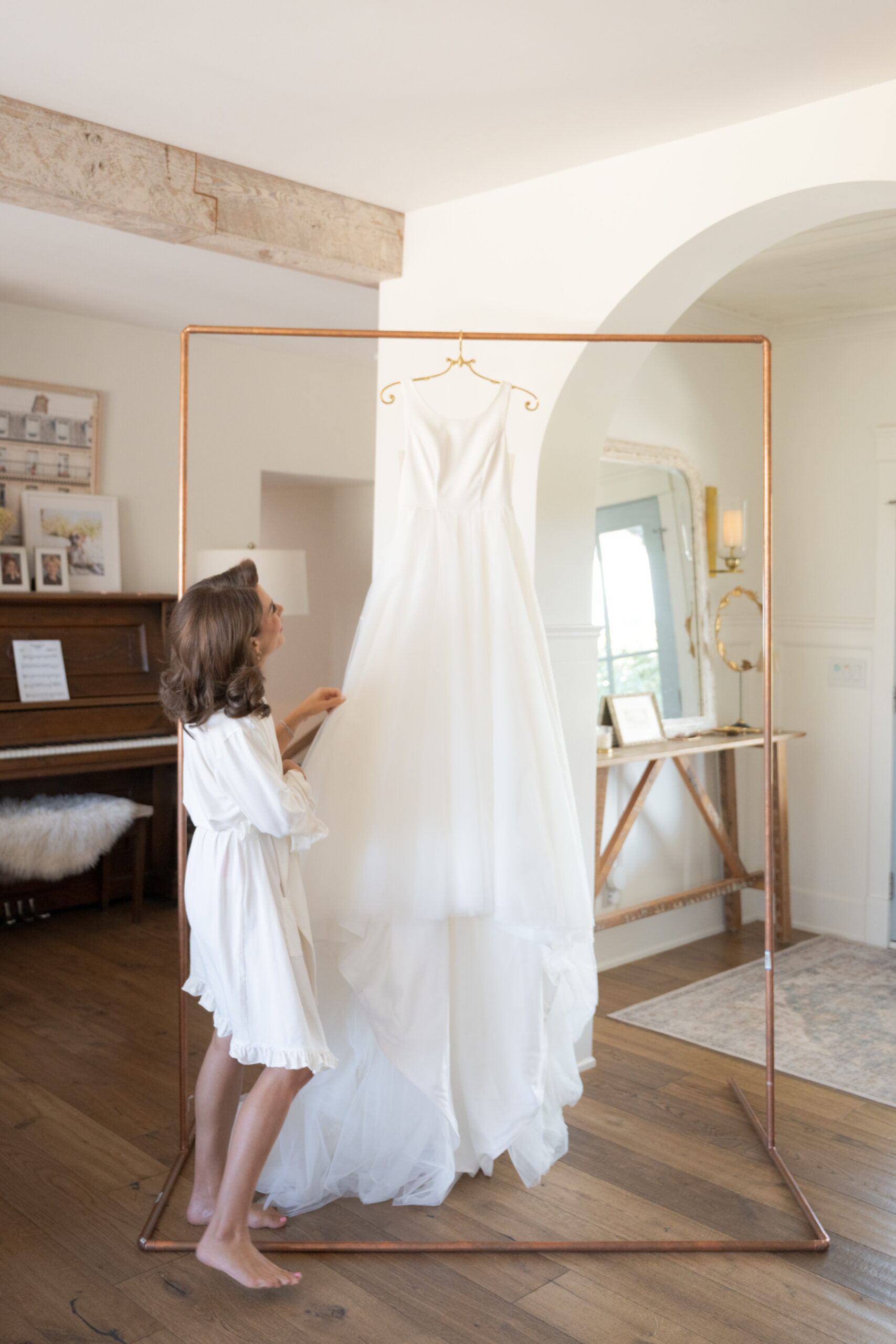 Jillian Harris beside her wedding dress