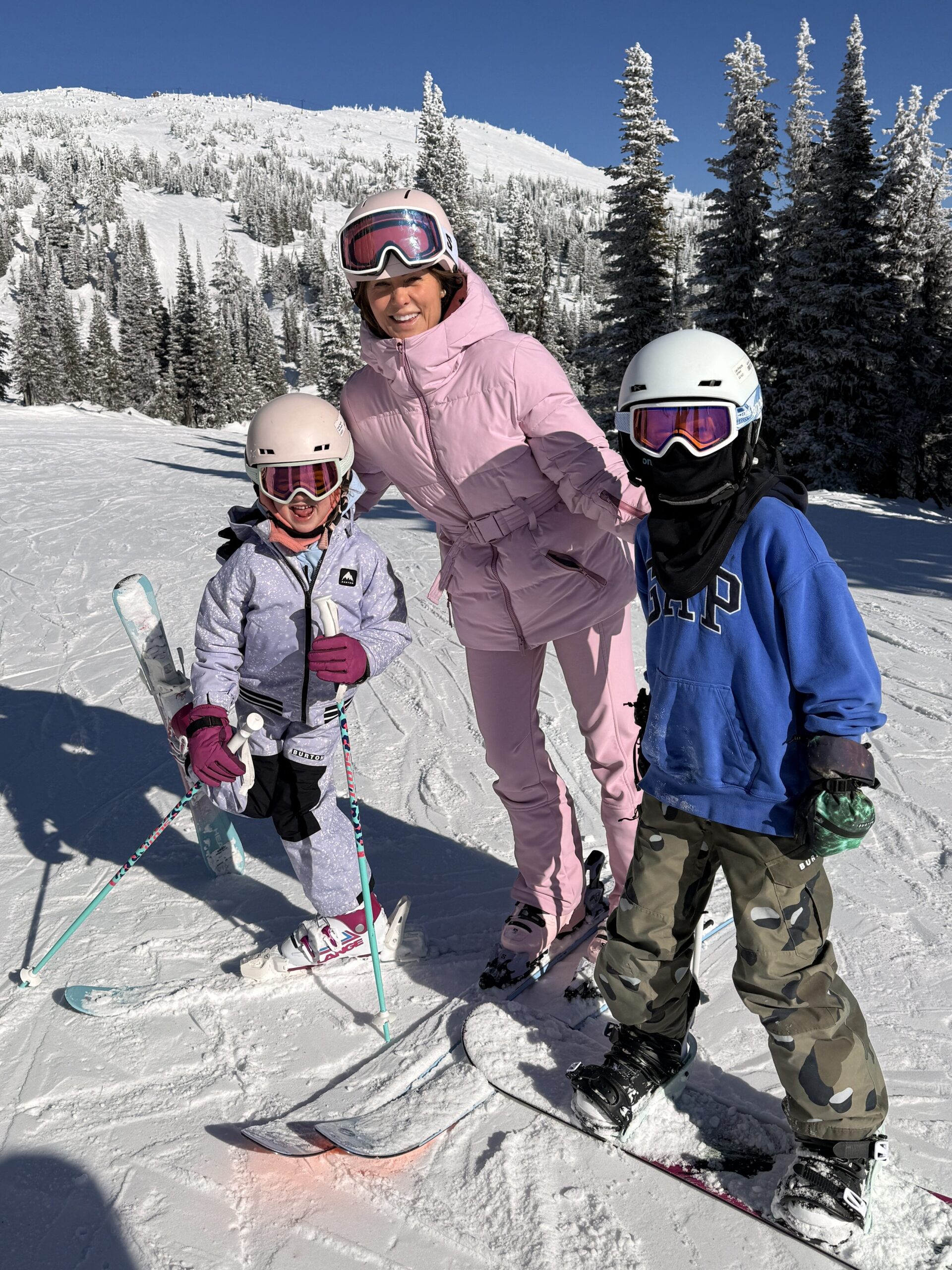Jillian, daughter Annie and son Leo skiing at Big White