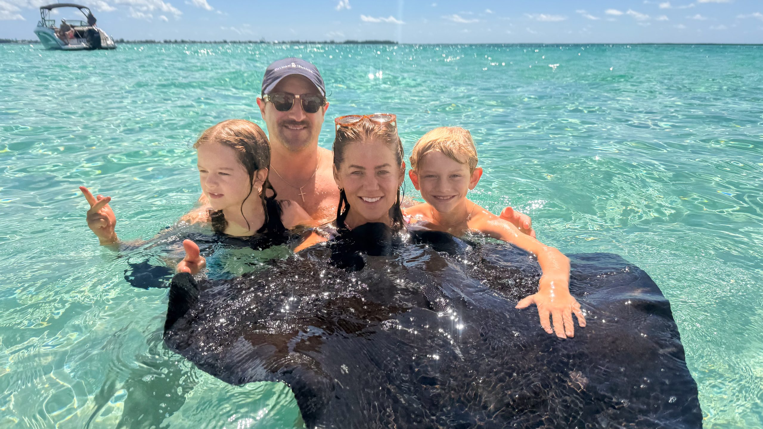 Jillian, Justin, Leo and Annie swimming with a stingray