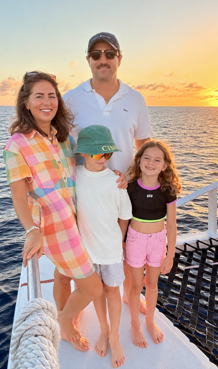 Jillian, Justin, Leo and Annie on a boat overlooking the sunset